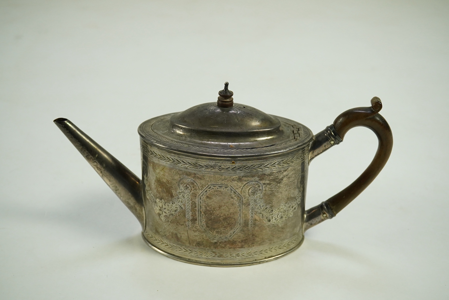 A George III silver oval teapot, overstruck maker's mark, T?